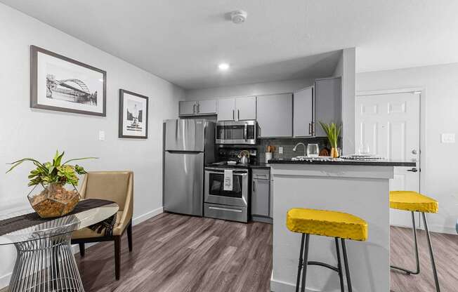 our apartments offer a kitchen and living room with stainless steel appliances