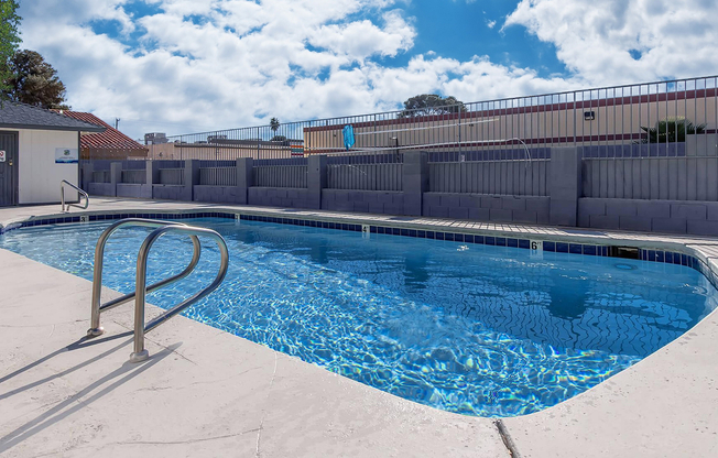 Dive into relaxation in this sun-drenched pool area, perfect for leisurely days.