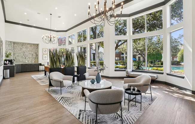 A large room with a lot of windows and a chandelier.
