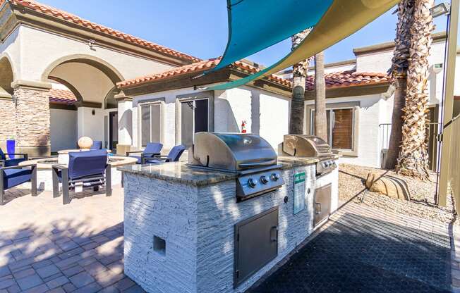 a bbq grill is available at the enclave at woodbridge apartments in sugar land,