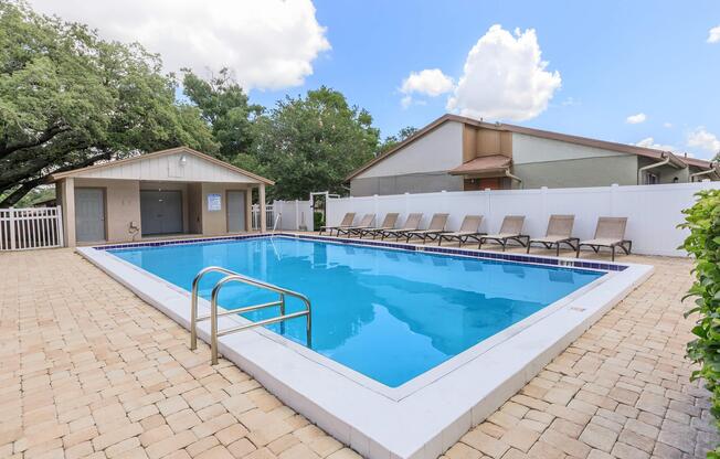 a house with a pool outside of a building