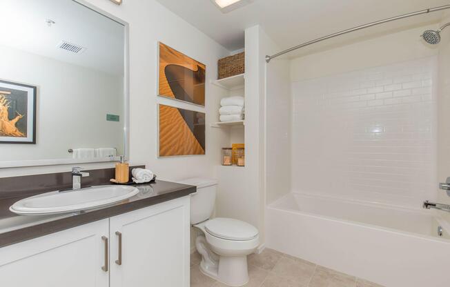 a room with a sink and a mirror
