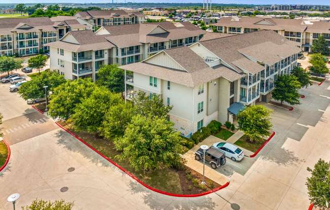 an aerial view of the leasing office at the enclave at woodbridge apartments in sugar land,