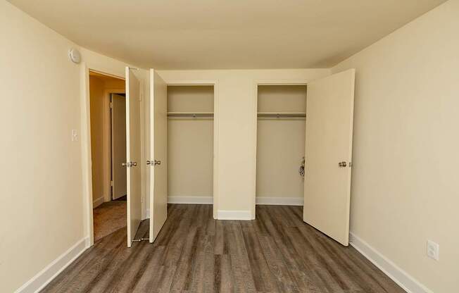 A room with a wooden floor and white walls.