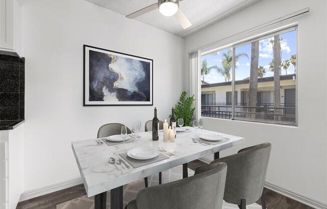 a dining room with a table and chairs at Pacific Rose California, 90034