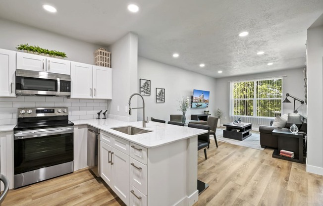 a kitchen and living room with a large window