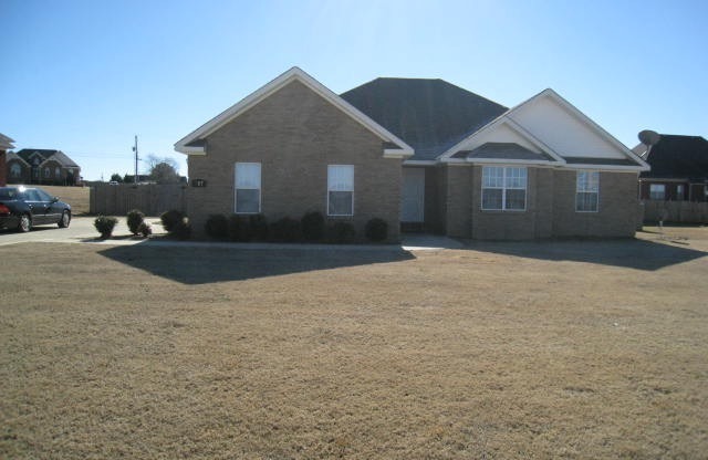 Large fenced back yard with patio