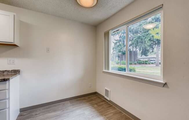 A Standard Kitchen and Window at Morningtree Park Apartments