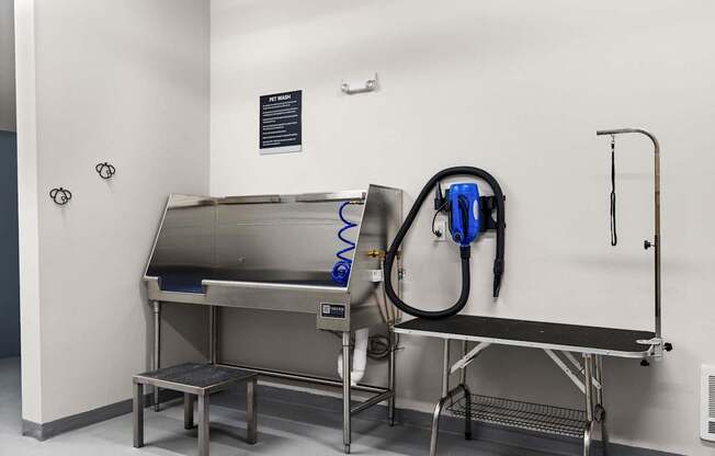 A cleaning machine is on a table in a room.