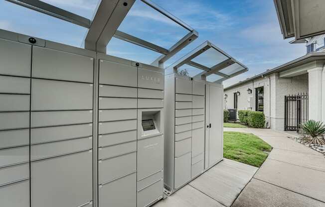 a pergola with a dog kennel attached to the side of a house