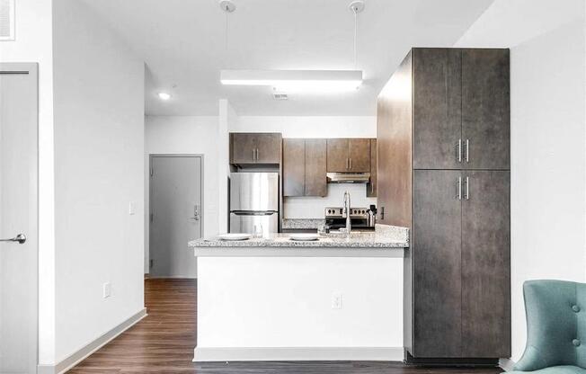 a kitchen with a counter top and a refrigerator