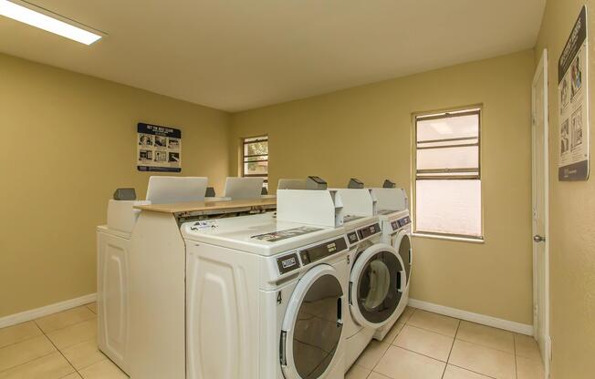 a room with a sink and a microwave