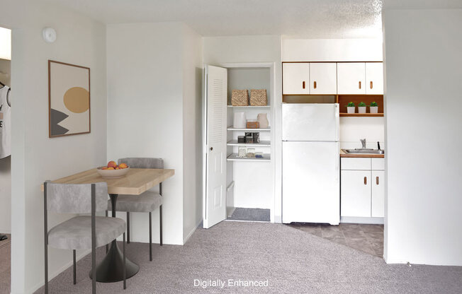 a kitchen and dining room with a closet at Seville Apartments, Kalamazoo, 49009