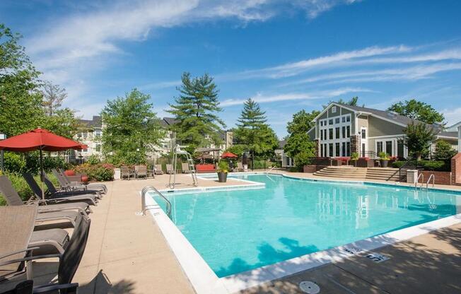 Germantown Apartments for Rent -Cherry Knoll Apartments Large Pool Lined With Lounge Chairs And Umbrellas And Trees