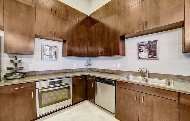 a kitchen with wooden cabinets and stainless steel appliances