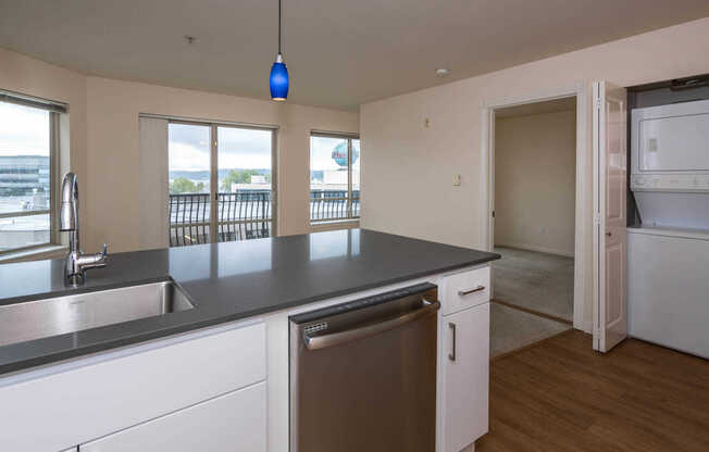 Kitchen with Stainless Steel Appliances and In-Home Washer and Dryer