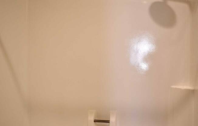 Tub shower combination with fiberglass surround