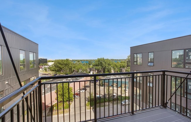 a balcony with a view of a parking lot
