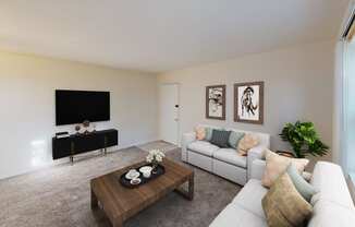 living area with sofa, coffee table, credenza, tv and view of front entrance at manor village apartments in washington dc
