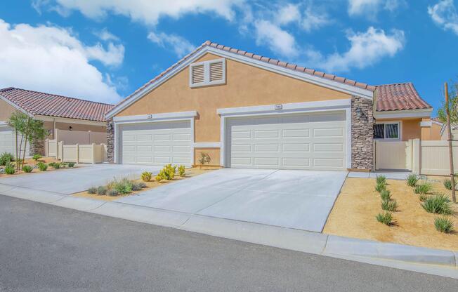 a house that has a sign on the side of a road