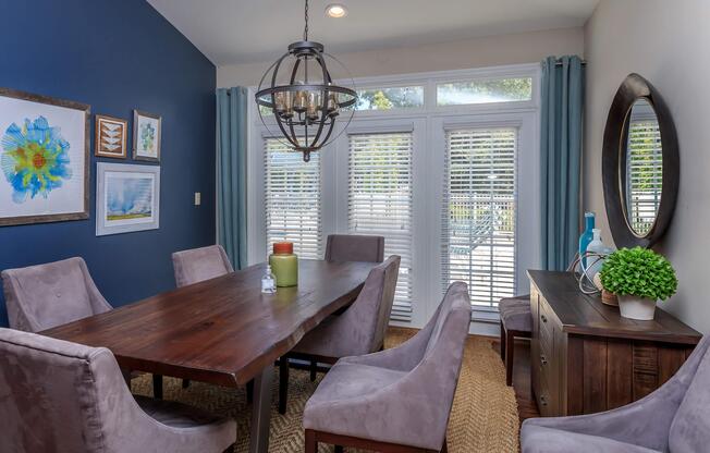 Dining room table and chairs at Ashley Oaks Apartments in Greensboro, North Carolina