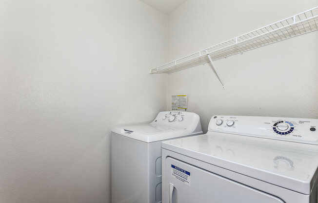 Laundry room with washer and a dryer