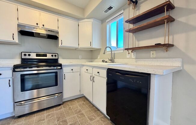 OCTOBER IS FREE!! 3-Bedroom Townhome with 2-Car Garage, Fenced Yard & In-Unit Laundry!