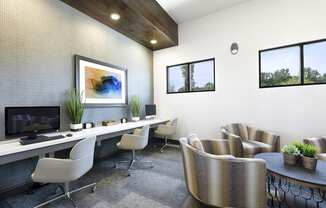 a modern office with chairs and a desk with a computer