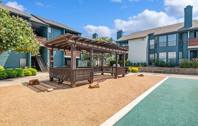 Outdoor Covered Seating Area at Bridges at Deer Run Apartments in Dallas, TX.