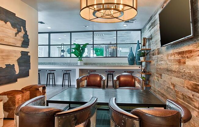 a dining room with a table and chairs