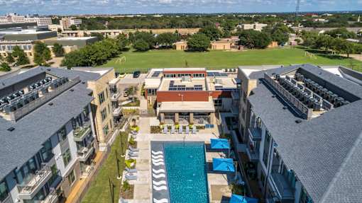 A large building with a pool in the middle of it.