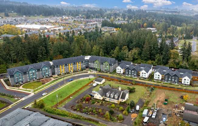an aerial view of a neighborhood with houses and a parking lot
