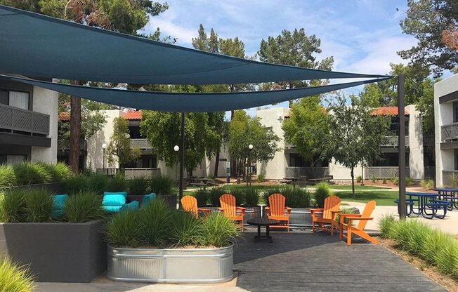 a patio with chairs and a canopy