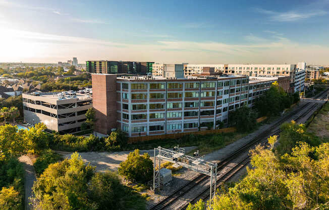 A train station with tracks and a train on the tracks.
