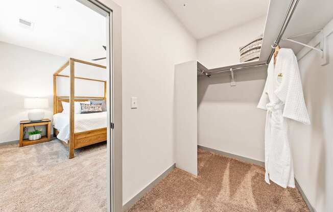 A white towel is hanging on a rack in a room
