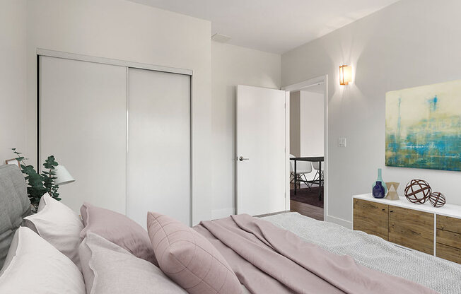 Carpeted bedroom with private closet.