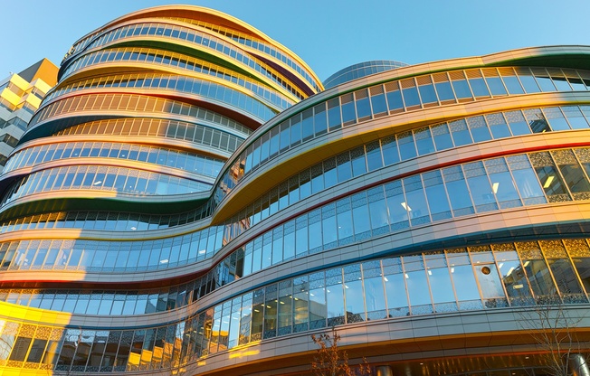 A modern building with curved glass windows.