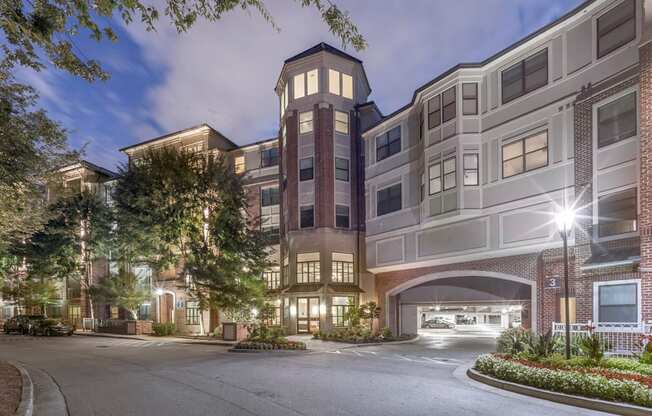 a street view of an apartment building at night at The Hendrix, Georgia, 30329