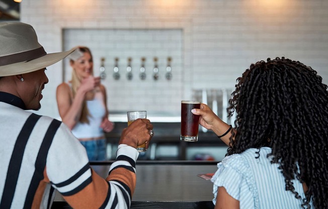 Share a laugh over drinks at a local bar near Novel Cary