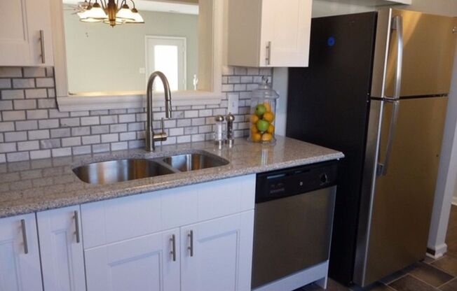 Fully updated townhome located walking distance to shops and close to interstates!
