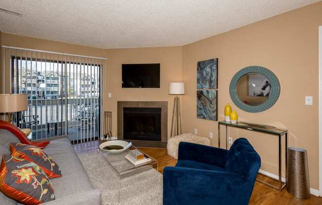 Living Room with Fireplace at Apres Apartments in Aurora, CO