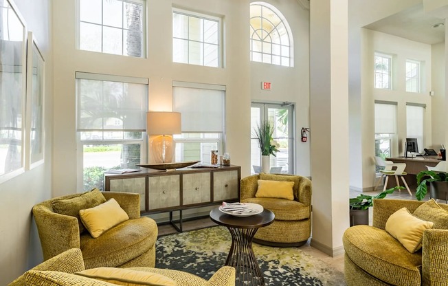 a living room filled with furniture and a large window