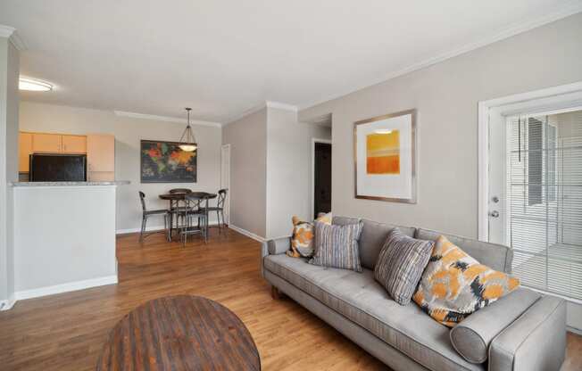 living room with wood-inspired flooring at Red Hawk Ranch apartments