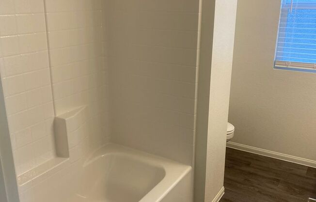 brand-new with two car garages, four bedrooms plus a loft, and two and a half bathrooms.