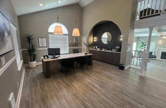 a large room with a desk and a mirror in it