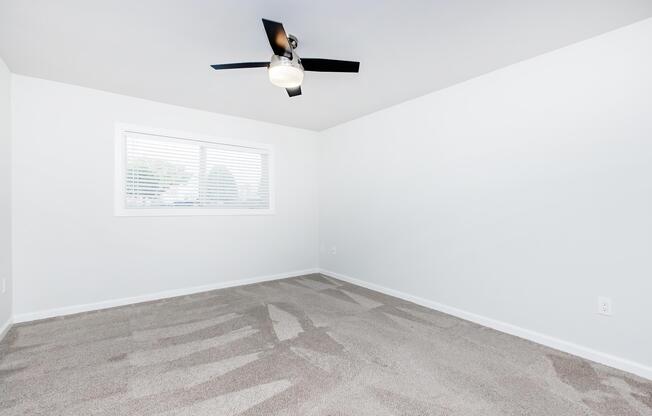 a bedroom with a bed and a mirror