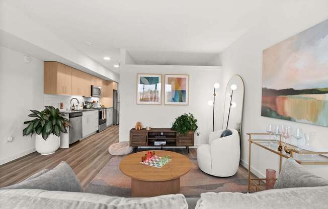 A modern living room with a grey sofa and a wooden coffee table.