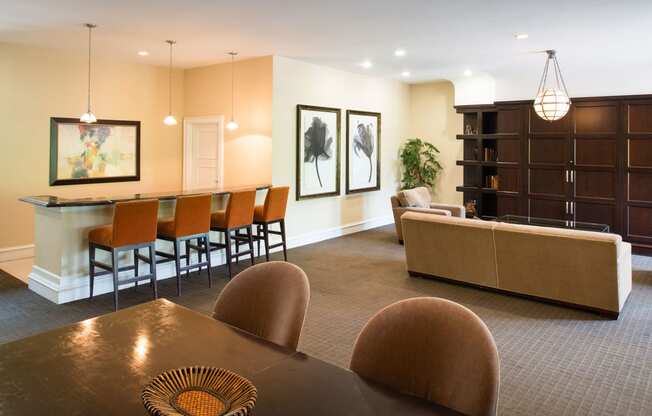 Resident clubhouse lounge area and breakfast bar section at Amberleigh apartments in Fairfax, Virginia 22031