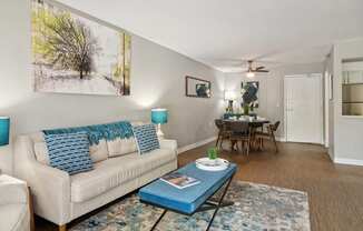 Living room and dining room with a couch and a coffee table