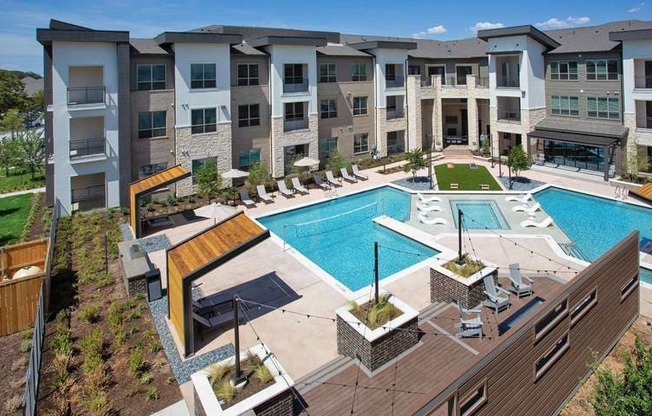 an aerial view of an apartment building with a swimming pool at Hunters Creek Apartments, Denton, 76210